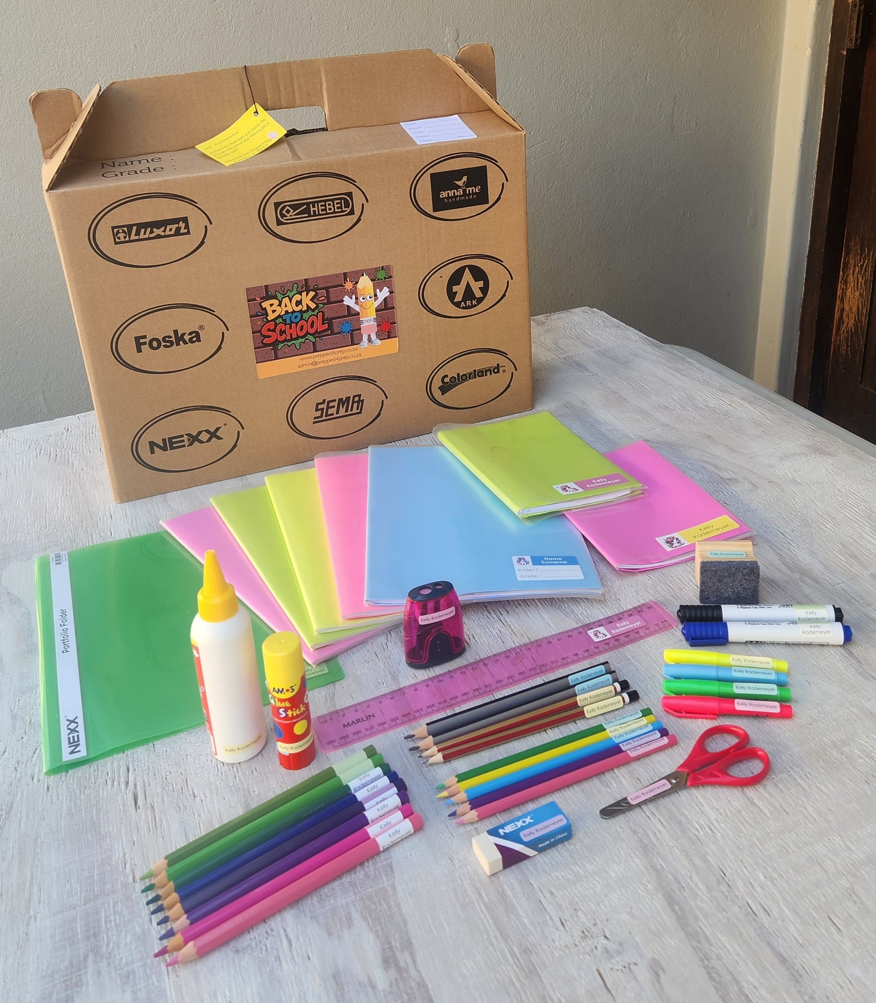 A Prepped 4 Prep box with covered, labelled stationery unpacked beside it